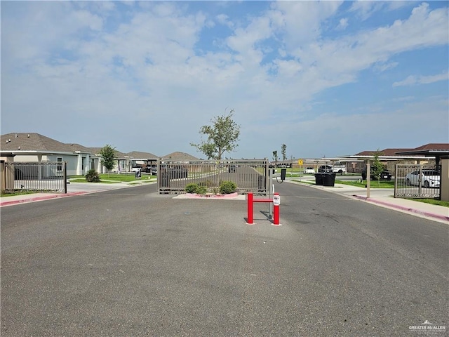 909 N Maryland St, Alton, TX 78573 - view of asphalt road featuring sidewalks, curbs, and a residential view