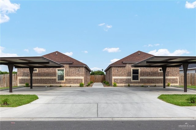 909 N Maryland St, Alton, TX 78573 - view of property exterior featuring brick siding and fence