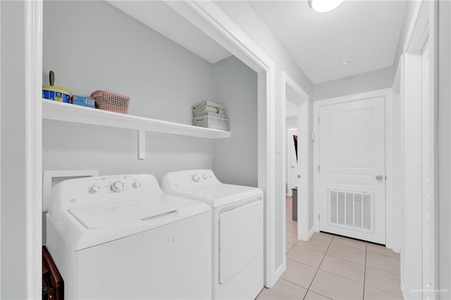 303 S Ridge Ln, San Juan, TX 78589 - laundry room featuring washer and clothes dryer and light tile patterned floors