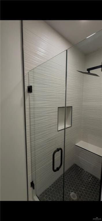 full bath featuring a shower stall