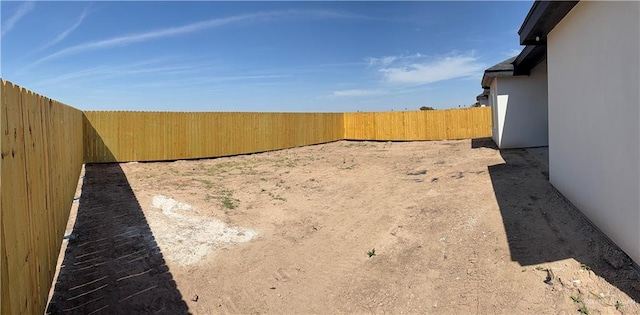 view of yard with a fenced backyard