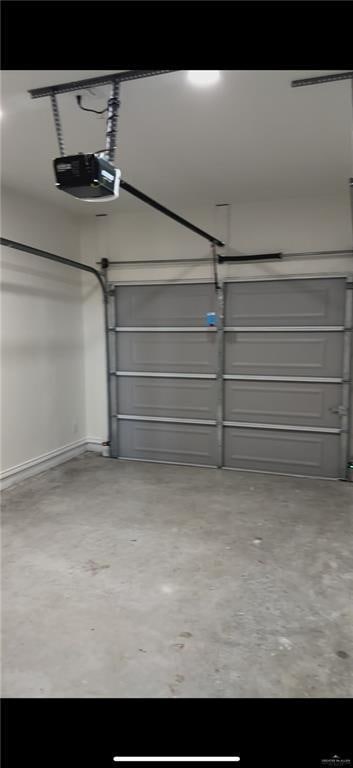 garage featuring a garage door opener