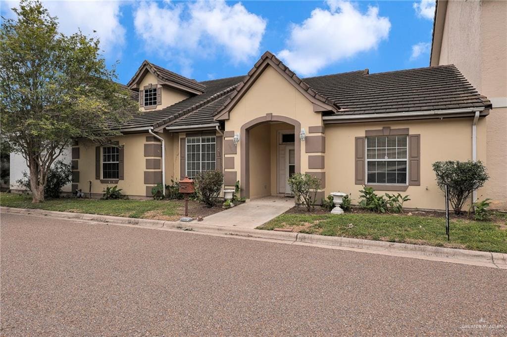 201 S Bales Rd Unit 17, Mcallen, TX 78503 - view of front of property featuring stucco siding and a tiled roof