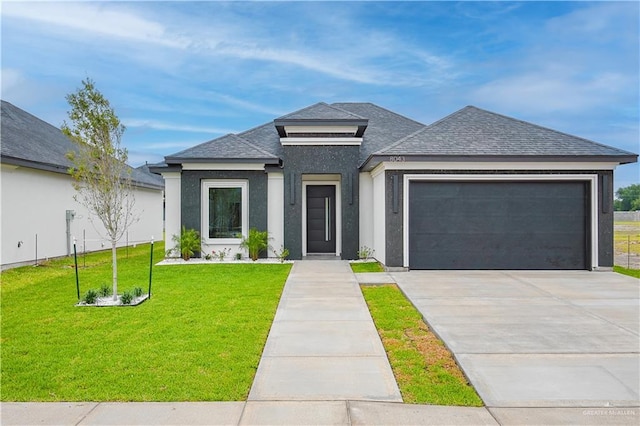 8043 N 50th St, Mcallen, TX 78504 - prairie-style home with driveway, a front yard, a garage, a shingled roof, and stucco siding