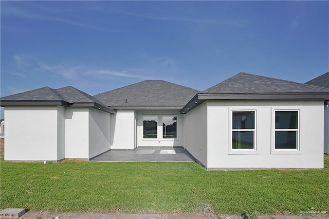 8043 N 50th St, Mcallen, TX 78504 - rear view of house featuring a shingled roof, a patio area, and a yard