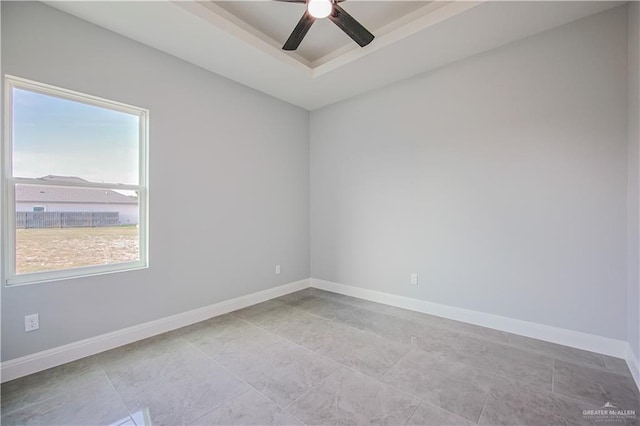 8043 N 50th St, Mcallen, TX 78504 - tiled empty room with baseboards, a raised ceiling, and ceiling fan