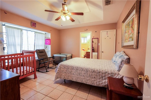 2020 N Lark Ave, Mcallen, TX 78504 - bedroom featuring light tile patterned floors, a ceiling fan, and a raised ceiling