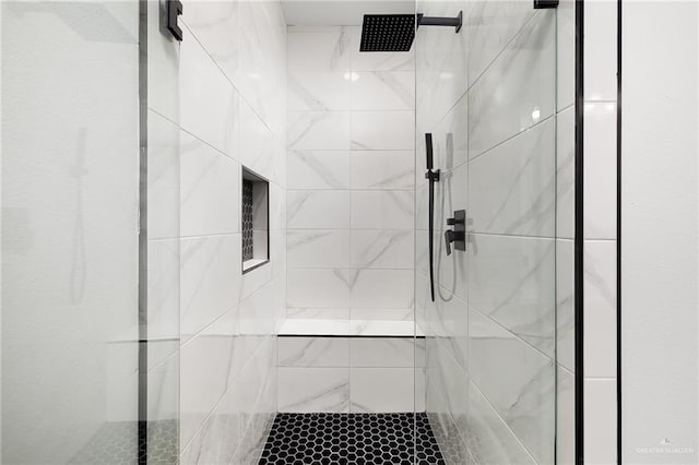 bathroom with tiled shower