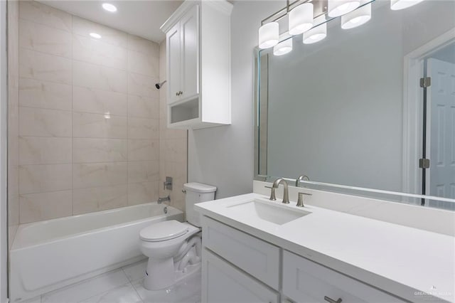 full bathroom with toilet, tiled shower / bath combo, and vanity