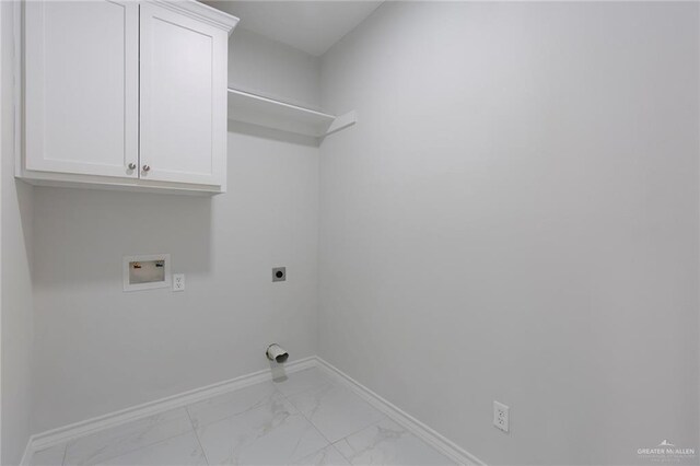 clothes washing area with cabinets, hookup for a washing machine, and electric dryer hookup