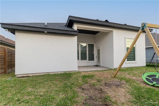 rear view of property with a patio area and a yard