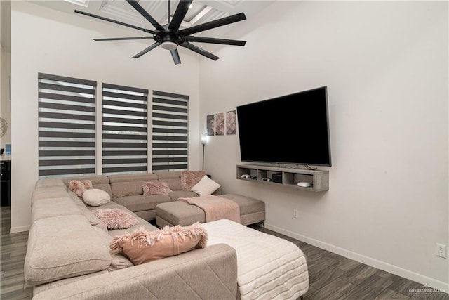 living room with ceiling fan and dark hardwood / wood-style flooring