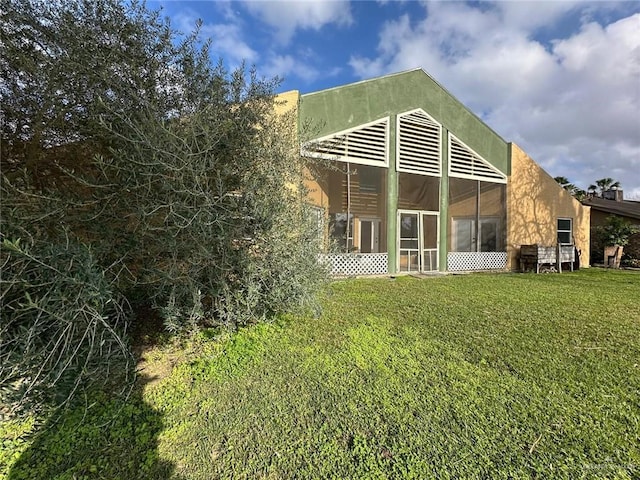 rear view of house with a lawn