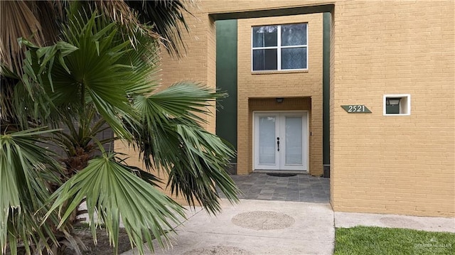 doorway to property with a patio area and french doors