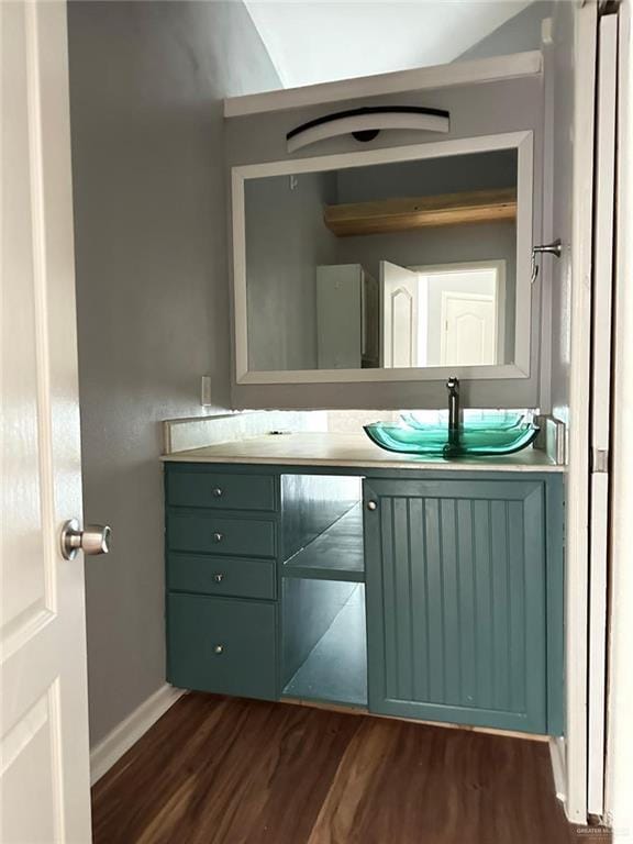 bathroom featuring hardwood / wood-style flooring and vanity