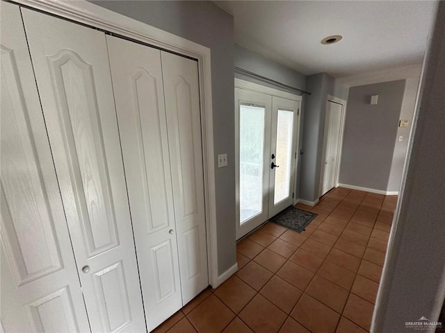 doorway featuring french doors and tile patterned flooring