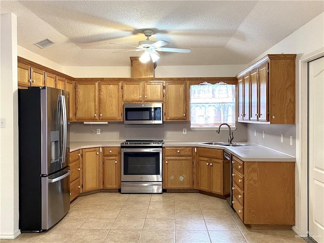 2508 Starling Cir W, Palmview, TX 78572 - kitchen with stainless steel appliances, visible vents, a sink, and a textured ceiling