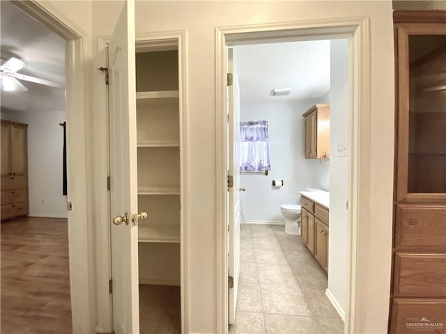 2508 Starling Cir W, Palmview, TX 78572 - bathroom featuring tile patterned flooring, toilet, vanity, a ceiling fan, and a closet