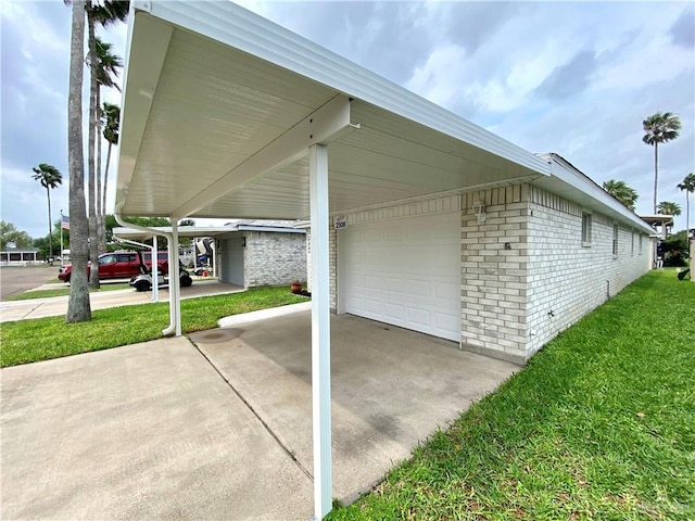 2508 Starling Cir W, Palmview, TX 78572 - exterior space with a carport, brick siding, a yard, and concrete driveway