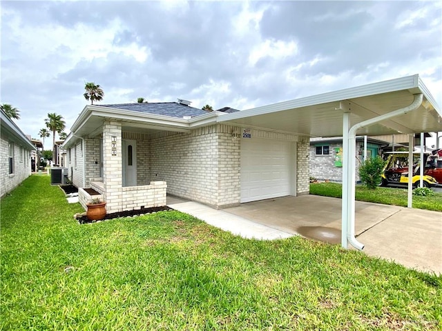 2508 Starling Cir W, Palmview, TX 78572 - view of front facade featuring central AC, a front lawn, driveway, an attached garage, and brick siding