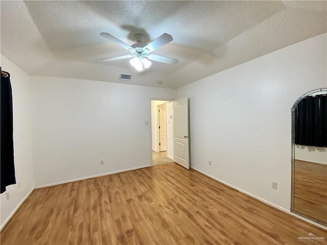 2508 Starling Cir W, Palmview, TX 78572 - unfurnished bedroom with a textured ceiling, baseboards, visible vents, light wood-style floors, and a ceiling fan