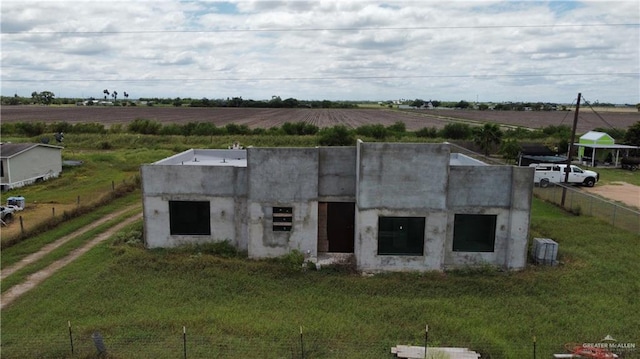 view of outdoor structure with a rural view