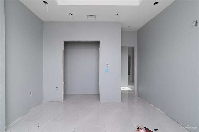 bedroom featuring light tile patterned floors