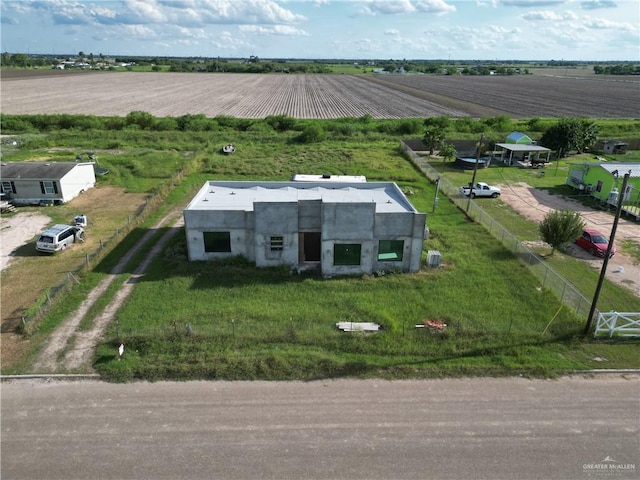 birds eye view of property with a rural view