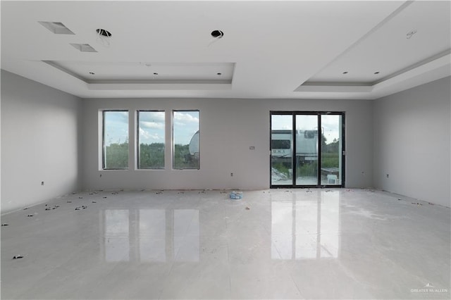 spare room featuring a raised ceiling