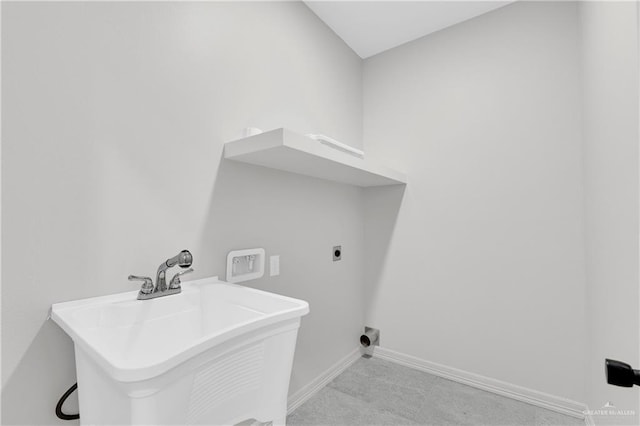 washroom featuring baseboards, a sink, hookup for an electric dryer, laundry area, and light colored carpet