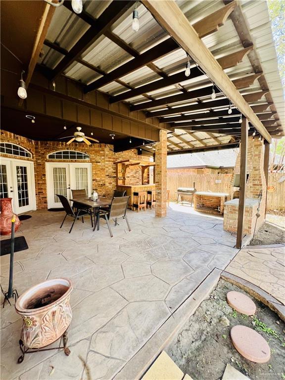 view of patio with french doors and ceiling fan