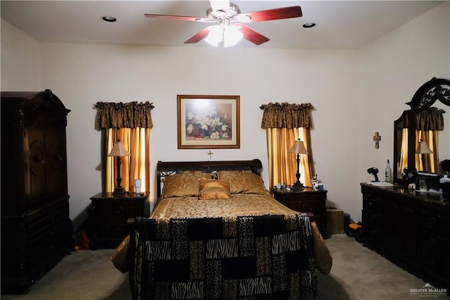 bedroom featuring ceiling fan and carpet floors