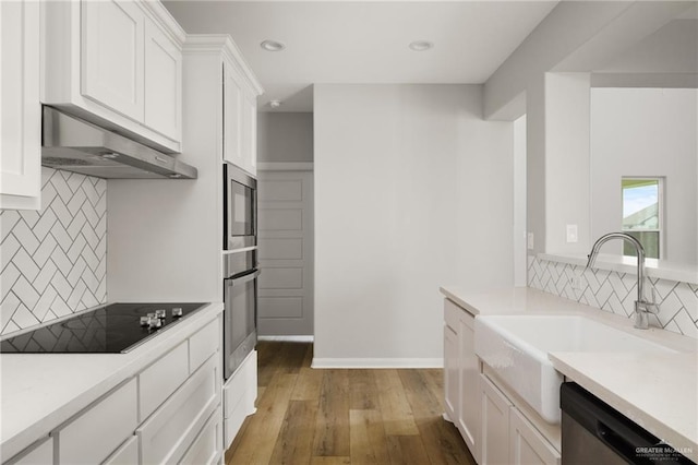 6300 Cascada Bend Rd, Mcallen, TX 78504 - kitchen featuring range hood, appliances with stainless steel finishes, tasteful backsplash, white cabinetry, and recessed lighting