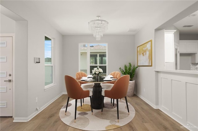 6300 Cascada Bend Rd, Mcallen, TX 78504 - dining area featuring light wood-type flooring and a chandelier