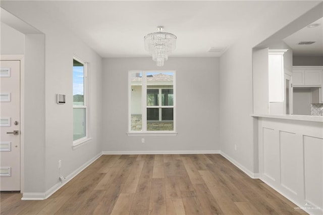 6300 Cascada Bend Rd, Mcallen, TX 78504 - unfurnished dining area featuring a chandelier and light wood finished floors