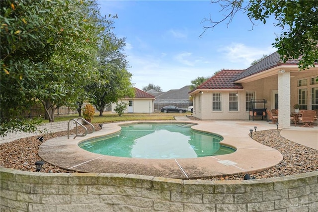 view of swimming pool featuring a patio area