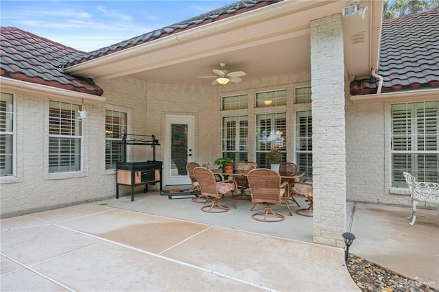 view of patio featuring ceiling fan