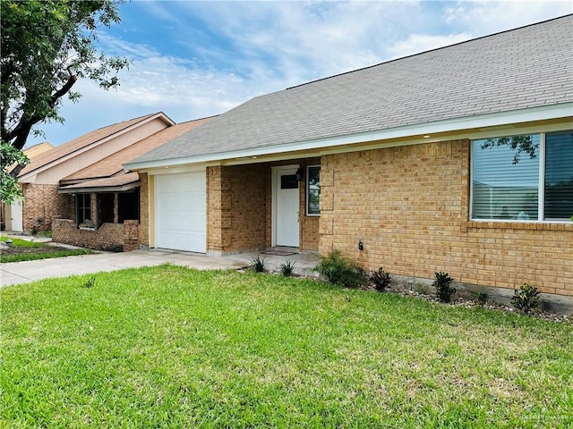 1523 Evergreen Ave, Mission, TX 78572 - single story home with a garage, brick siding, a front yard, driveway, and roof with shingles