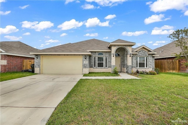 ranch-style house featuring a garage and a front lawn