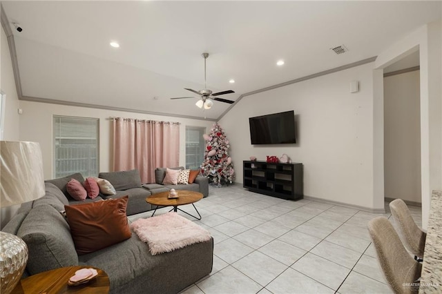 living room with vaulted ceiling, ornamental molding, ceiling fan, and light tile patterned flooring