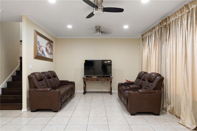 tiled living room with ceiling fan and ornamental molding