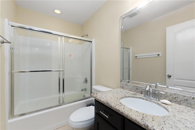 full bathroom with shower / bath combination with glass door, vanity, and toilet