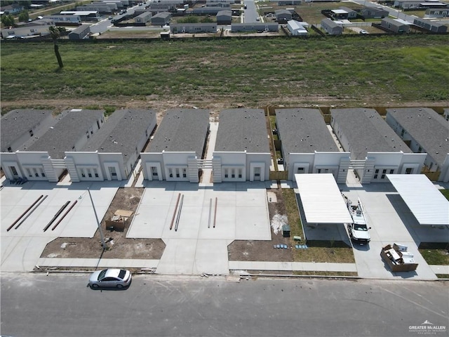 birds eye view of property with a residential view