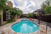 pool featuring a patio area and a fenced backyard