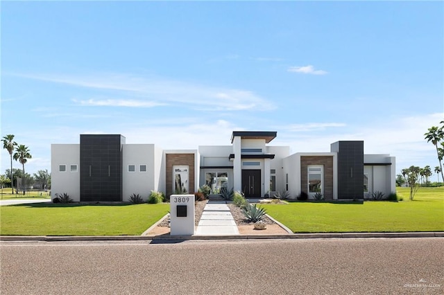 modern home with a front lawn