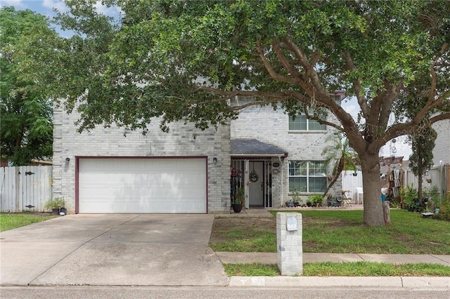 view of front of property with a front lawn and a garage