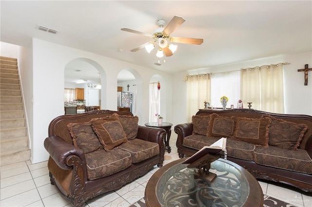 living room with light tile patterned floors and ceiling fan