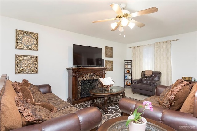 tiled living room with ceiling fan