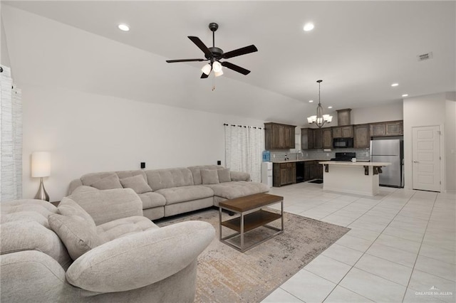 living room featuring lofted ceiling, light tile patterned flooring, recessed lighting, ceiling fan with notable chandelier, and visible vents