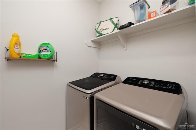 clothes washing area featuring laundry area and washer and dryer